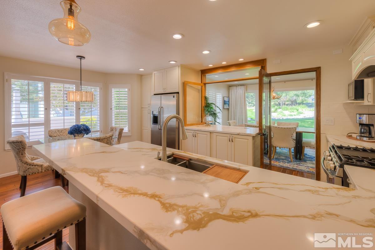 858 Lighthouse Court Reno, NV 89511 - Photo 13 of 39 a room with large windows and chandelier