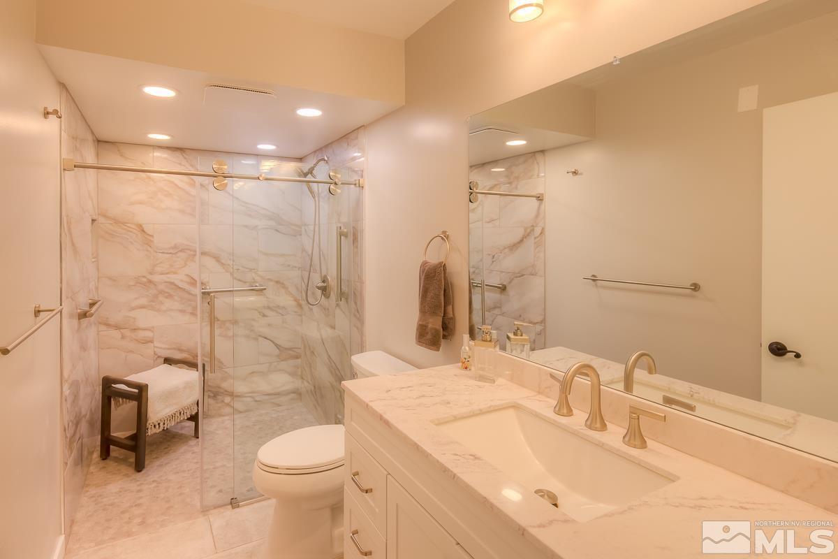 858 Lighthouse Court Reno, NV 89511 - Photo 15 of 39 a bathroom with a sink toilet and shower