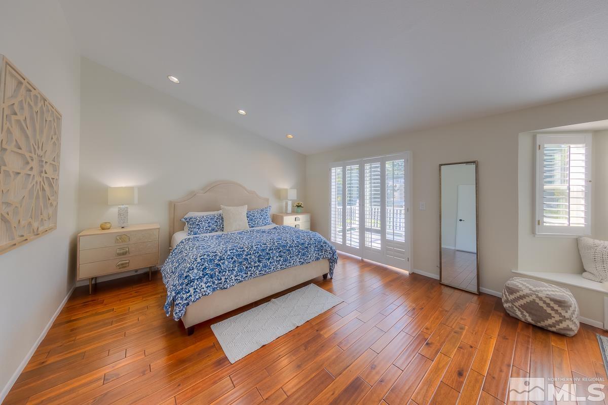 858 Lighthouse Court Reno, NV 89511 - Photo 19 of 39 a bedroom with a bed and wooden floor
