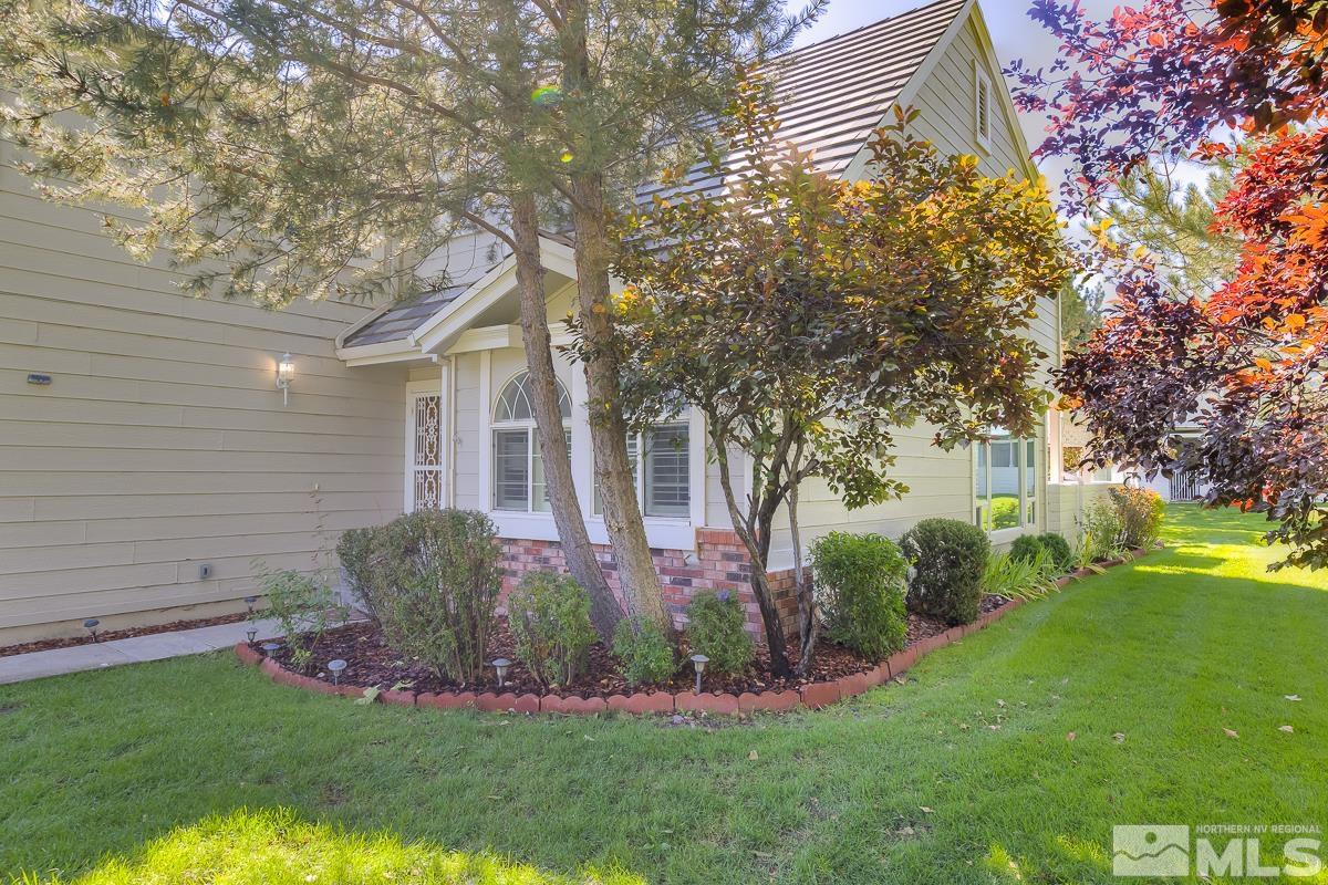 858 Lighthouse Court Reno, NV 89511 - Photo 2 of 39 a front view of a house with garden