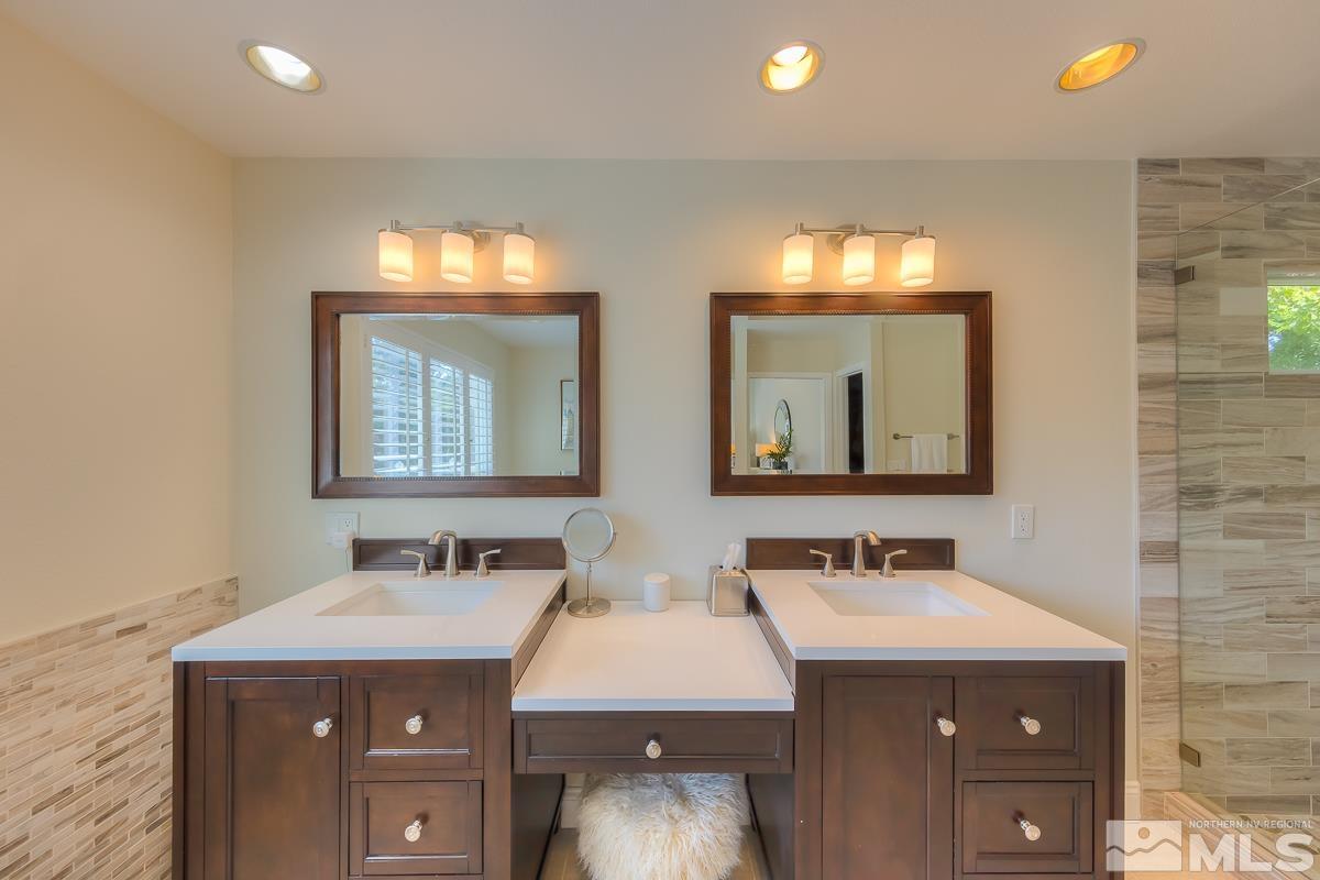 858 Lighthouse Court Reno, NV 89511 - Photo 23 of 39 a bathroom with a sink and a mirror