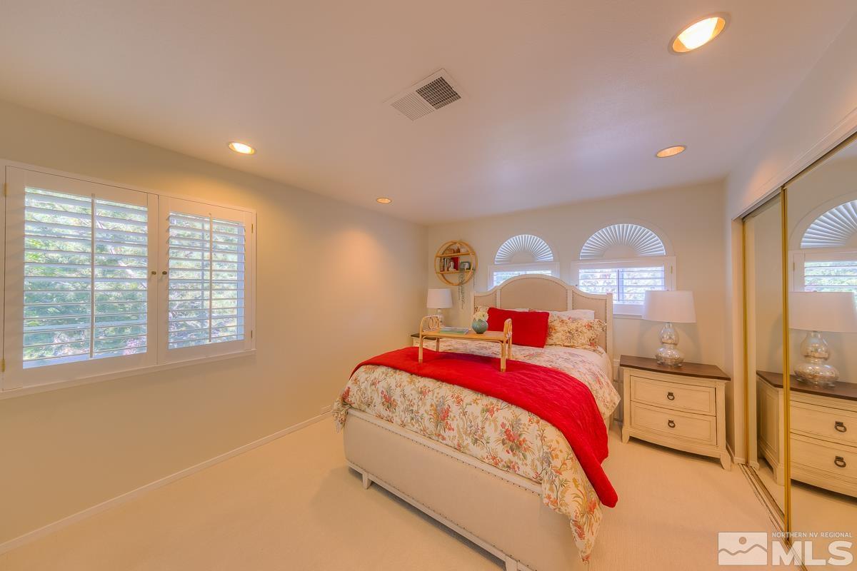 858 Lighthouse Court Reno, NV 89511 - Photo 26 of 39 a bedroom with a bed and window