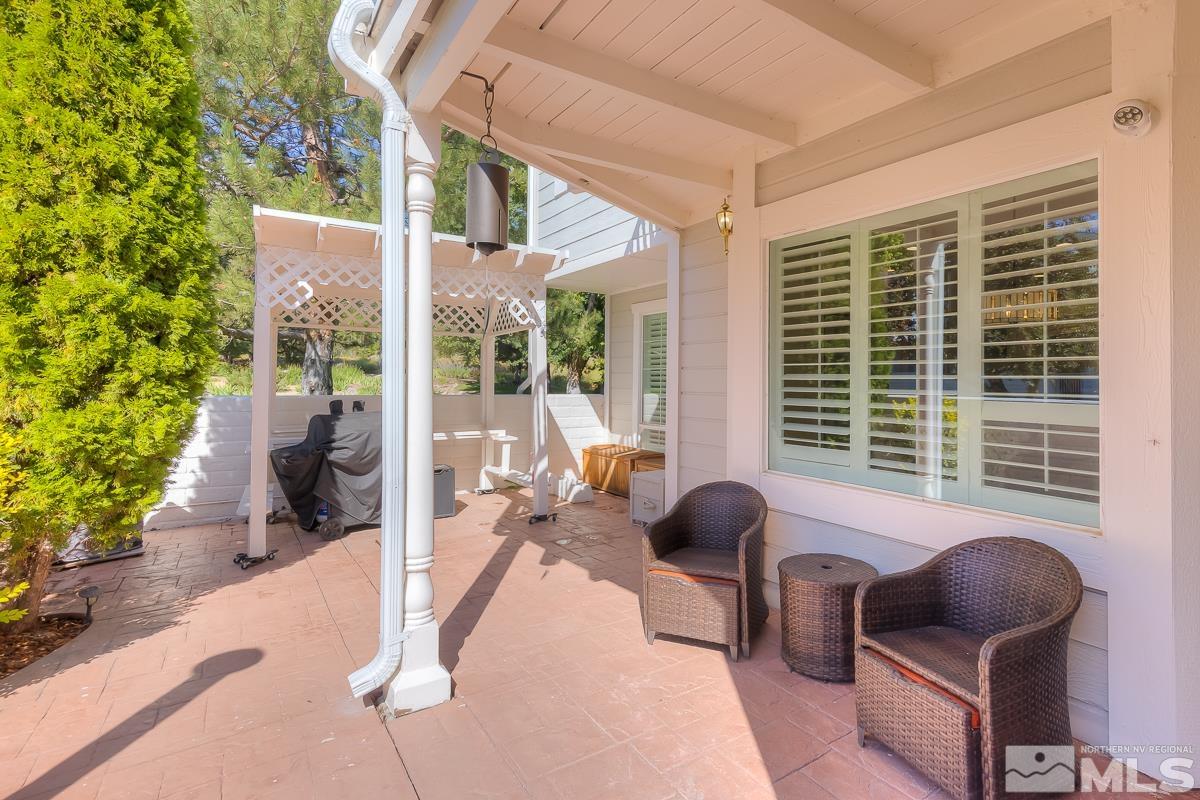 858 Lighthouse Court Reno, NV 89511 - Photo 31 of 39 a outdoor living space with furniture and a potted plant