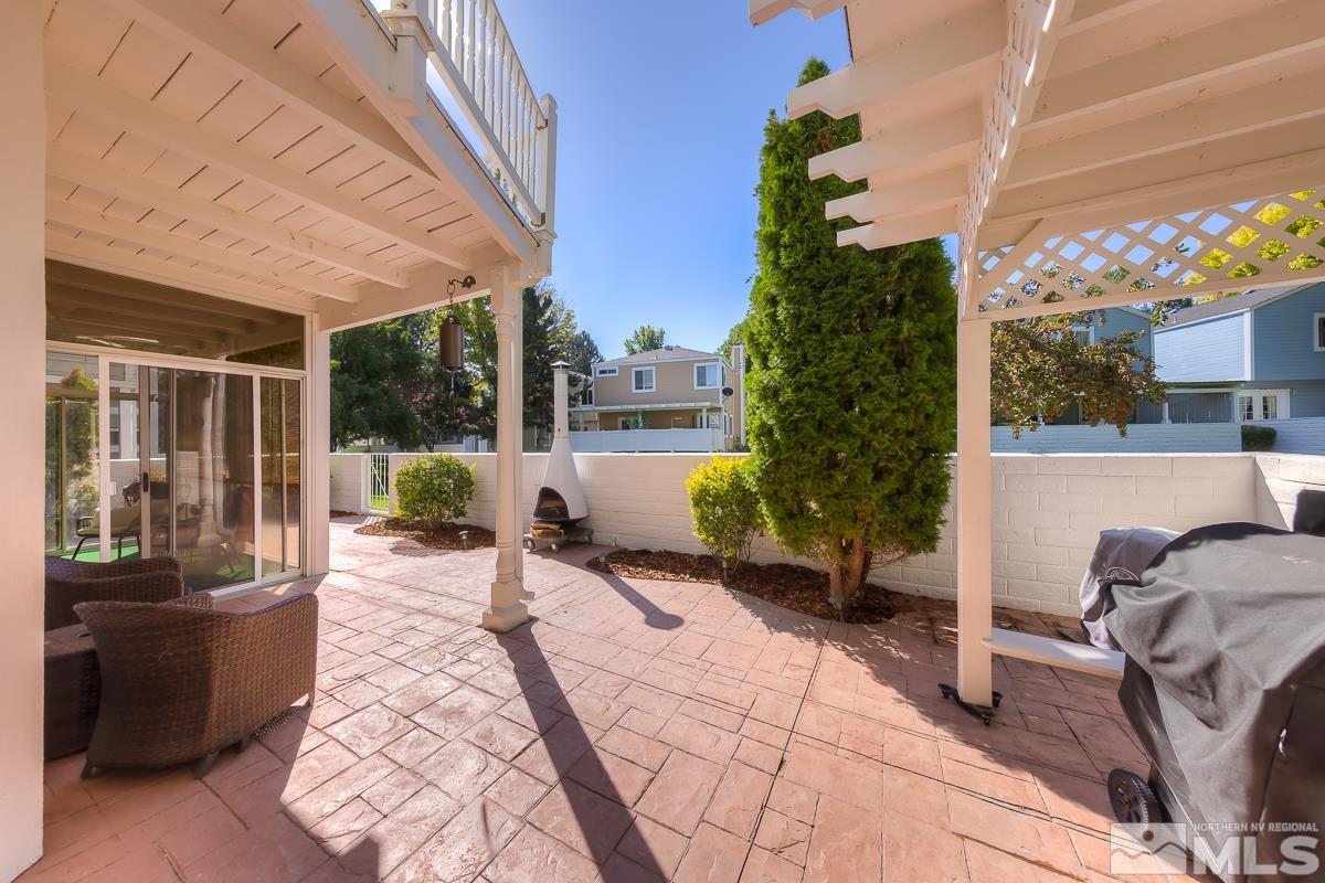 858 Lighthouse Court Reno, NV 89511 - Photo 32 of 39 a view of a patio with chairs and potted plants