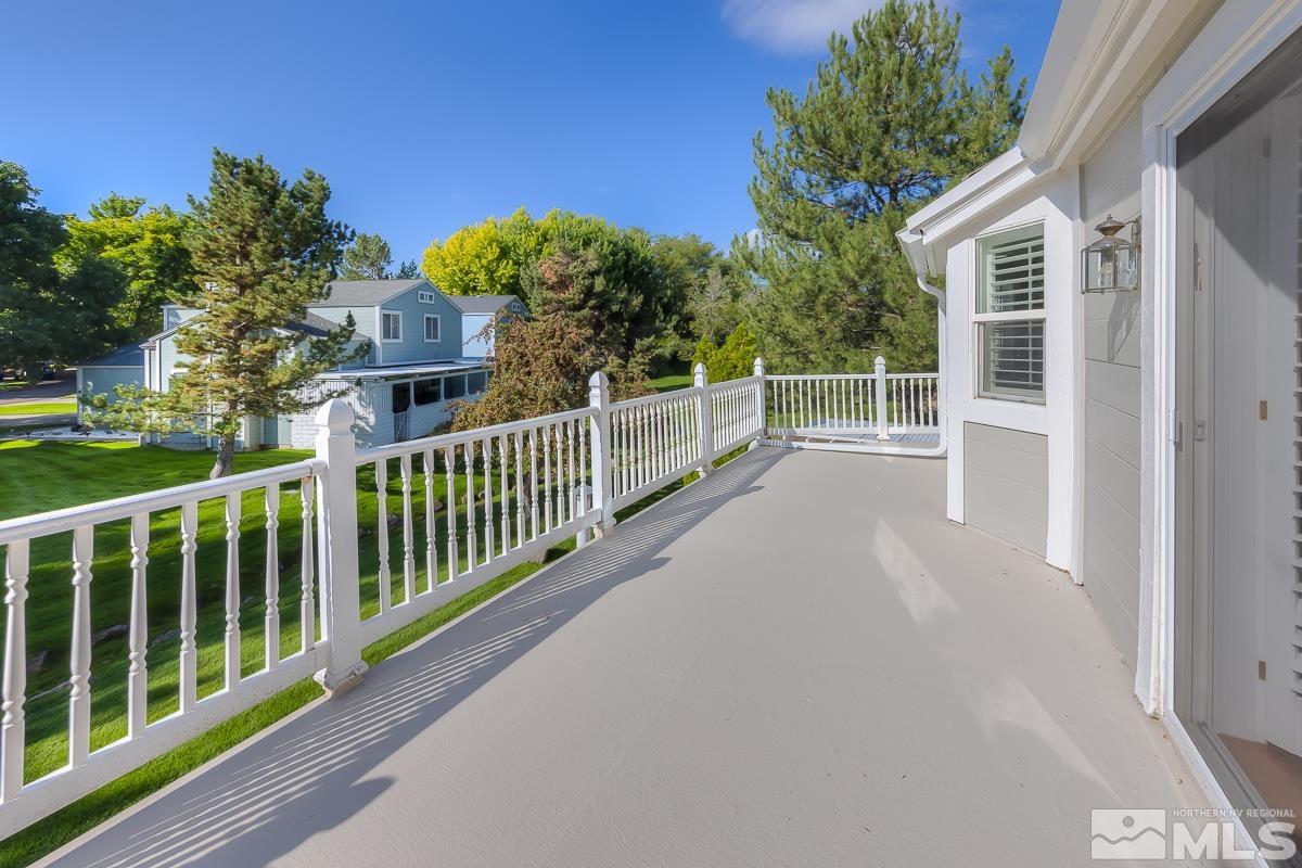 858 Lighthouse Court Reno, NV 89511 - Photo 37 of 39 a view of a house with a small yard and wooden fence