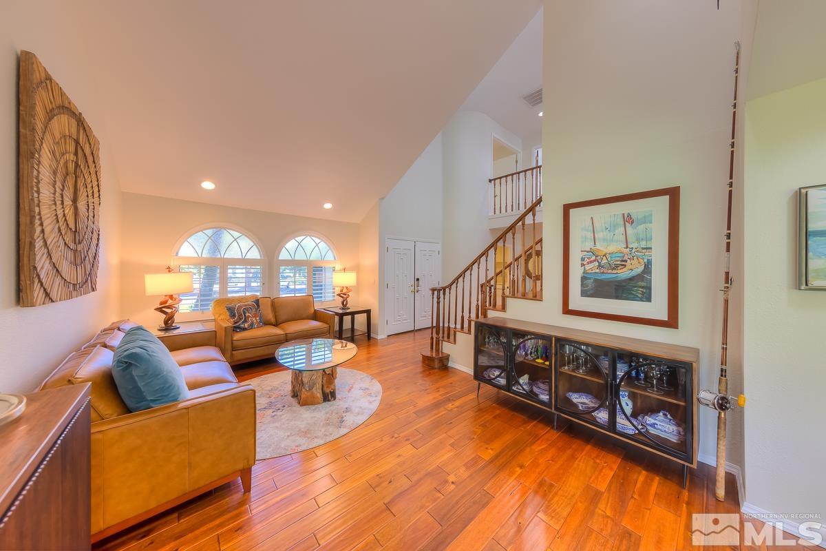 858 Lighthouse Court Reno, NV 89511 - Photo 4 of 39 a living room with fireplace furniture and a wooden floor