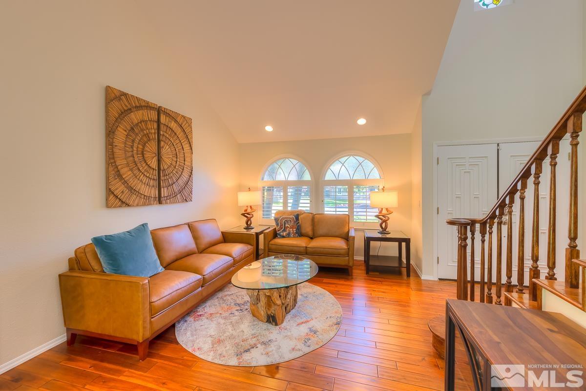 858 Lighthouse Court Reno, NV 89511 - Photo 5 of 39 a living room with fireplace furniture and a wooden floor
