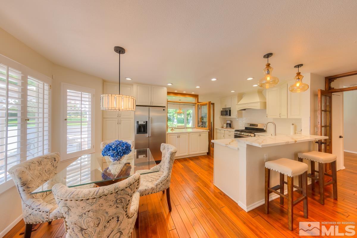 858 Lighthouse Court Reno, NV 89511 - Photo 10 of 39 a large kitchen with a table and chairs