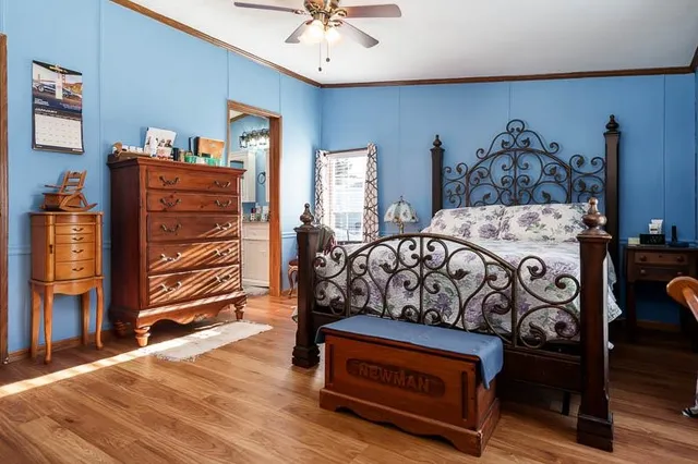 a bedroom with a bed and a dresser