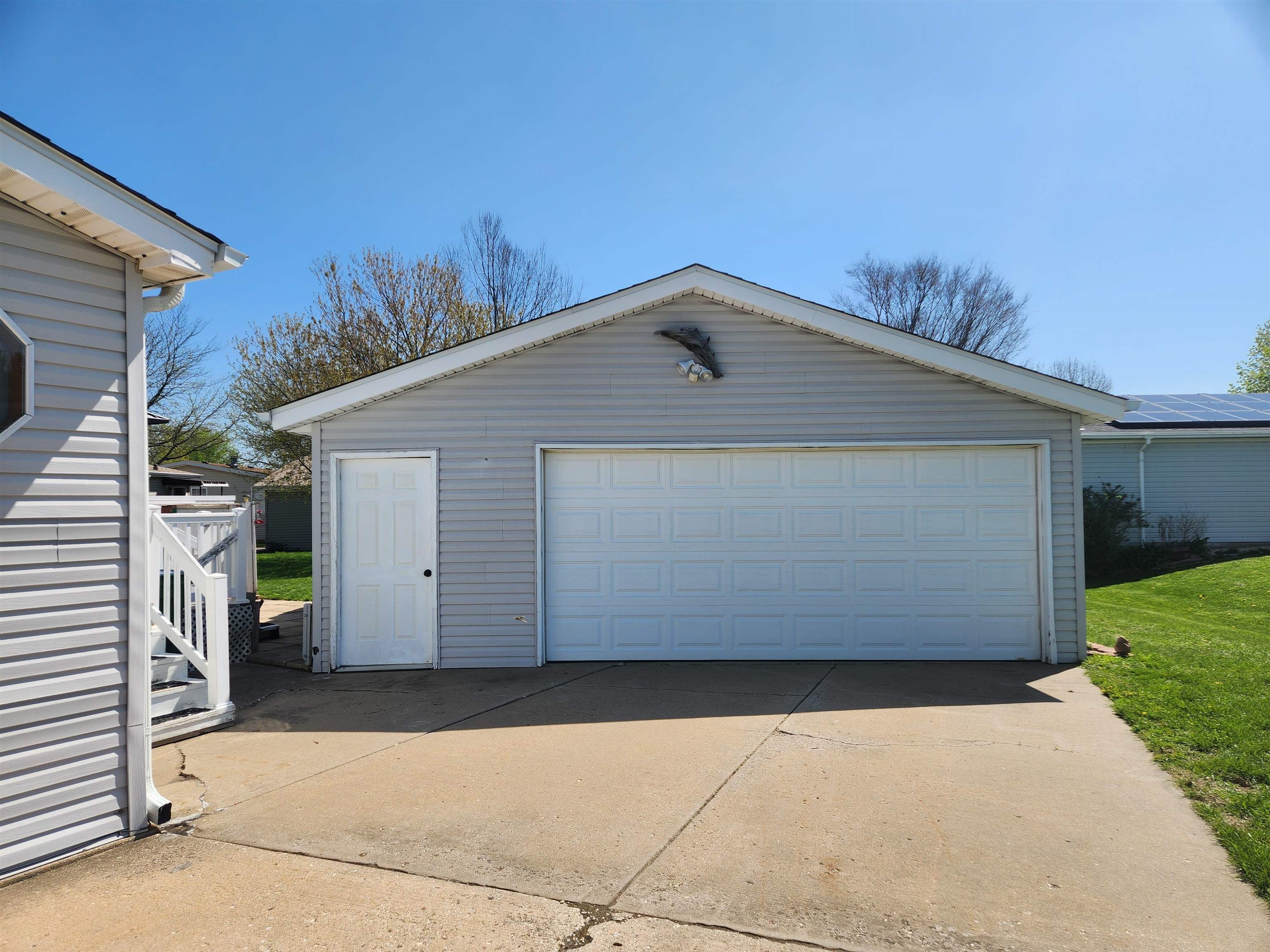 8511 Fig Tree Lane Roscoe, IL 61073 - Photo 2 of 35 a front view of a house with a garage