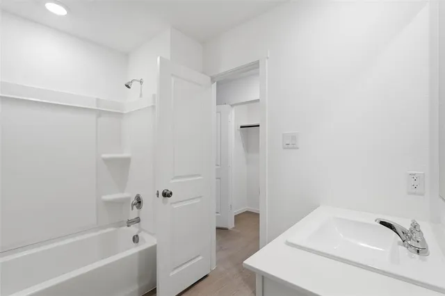 a bathroom with a sink and a bathtub