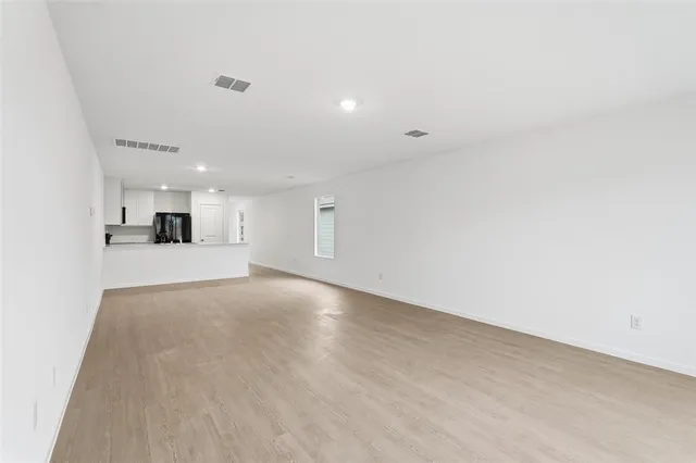a view of a kitchen with a sink and a window