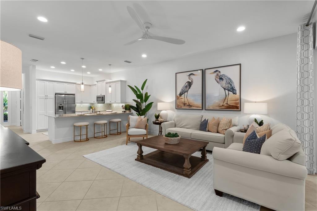 13459 Sumter Lane Naples, FL 34109 - Photo 1 of 40 a living room with furniture and view of kitchen