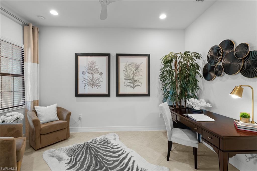 13459 Sumter Lane Naples, FL 34109 - Photo 11 of 40 a living room with furniture and a potted plant