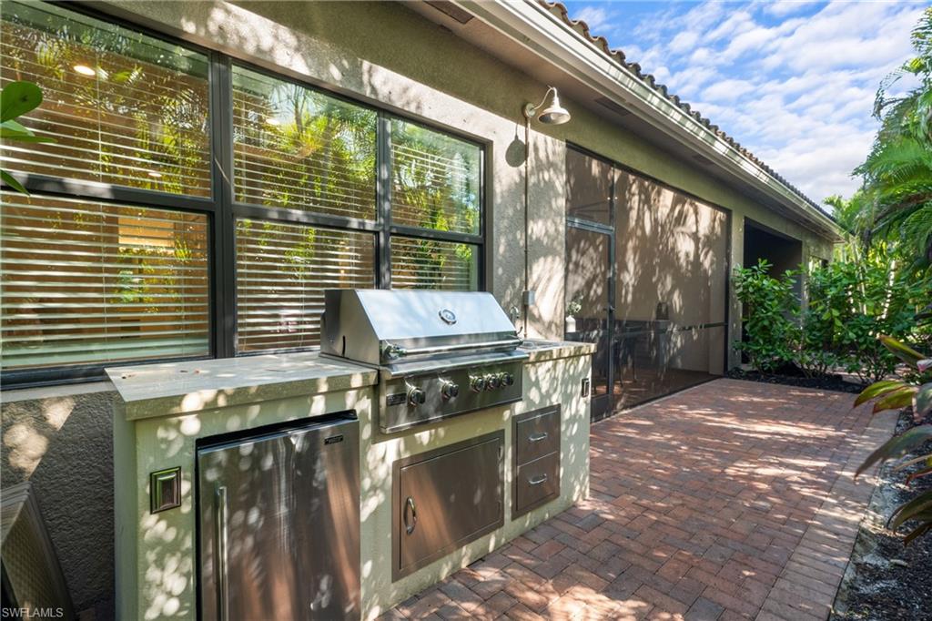 13459 Sumter Lane Naples, FL 34109 - Photo 23 of 40 a view of an outdoor kitchen