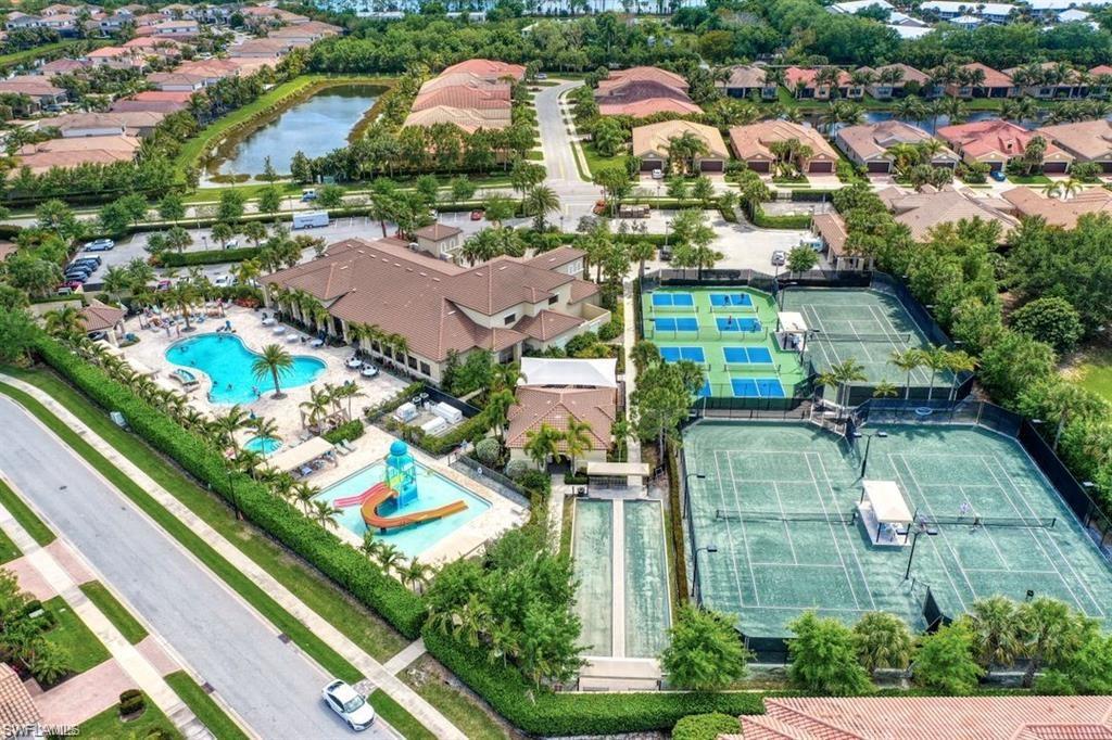 13459 Sumter Lane Naples, FL 34109 - Photo 27 of 40 an aerial view of residential houses with outdoor space and swimming pool