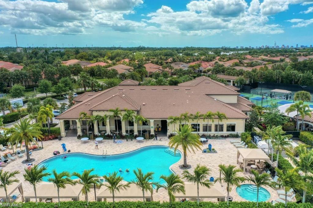 13459 Sumter Lane Naples, FL 34109 - Photo 28 of 40 an aerial view of house with swimming pool patio and lake view