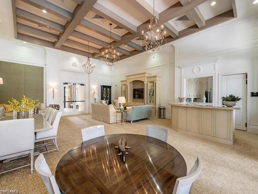 13459 Sumter Lane Naples, FL 34109 - Photo 31 of 40 a living room with furniture and a chandelier