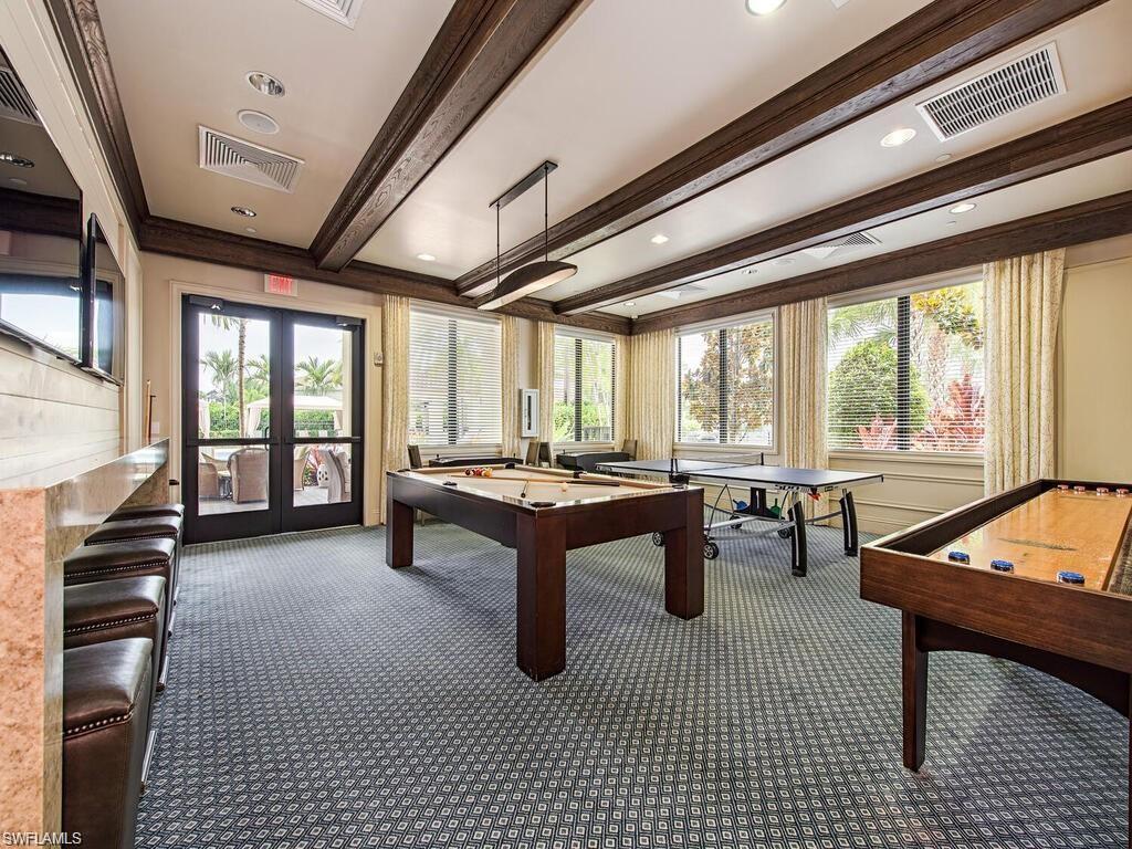 13459 Sumter Lane Naples, FL 34109 - Photo 33 of 40 a room with lots of table and chairs