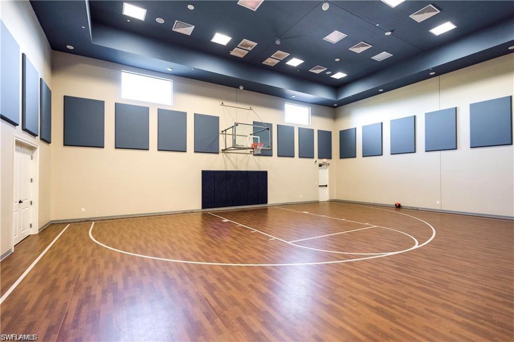 13459 Sumter Lane Naples, FL 34109 - Photo 35 of 40 a view of an empty room with wooden floor and windows