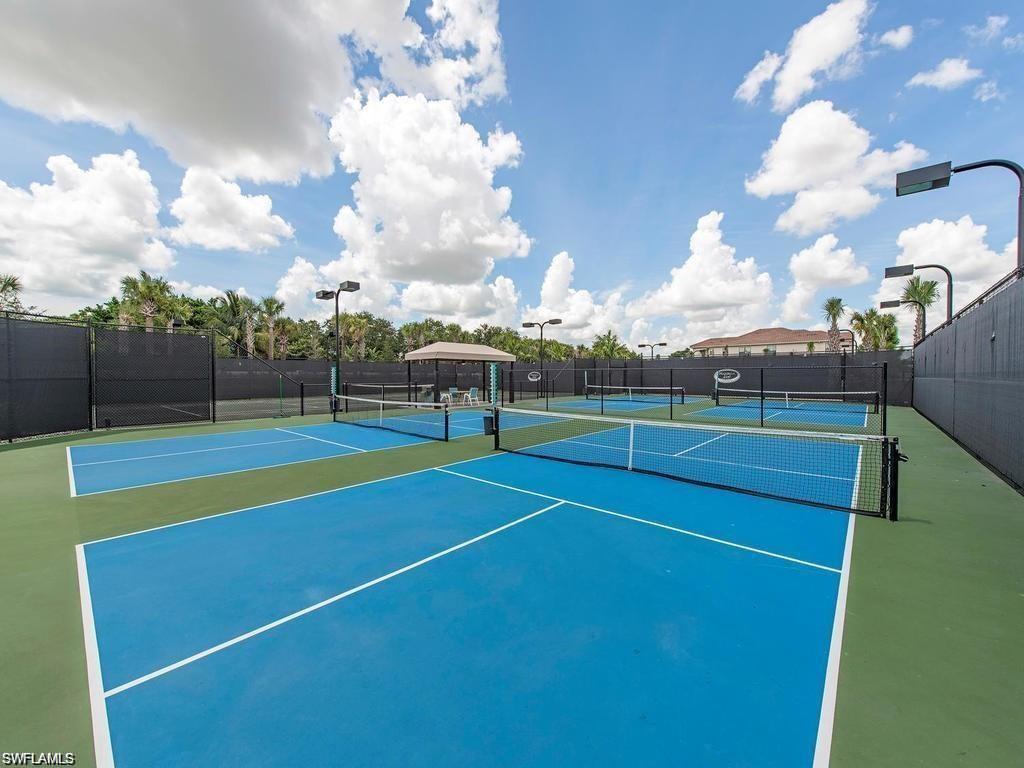 13459 Sumter Lane Naples, FL 34109 - Photo 37 of 40 a view of a tennis court