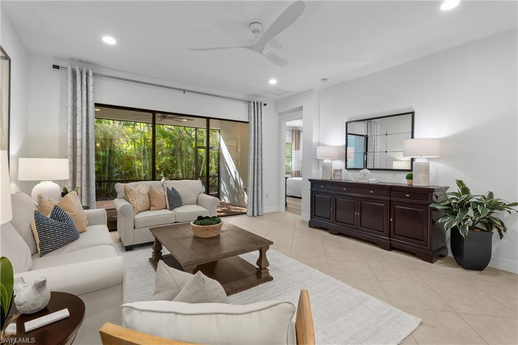 13459 Sumter Lane Naples, FL 34109 - Photo 4 of 40 a living room with furniture and a large window