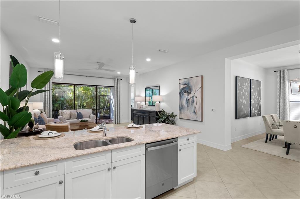 13459 Sumter Lane Naples, FL 34109 - Photo 8 of 40 a kitchen with a sink and large window
