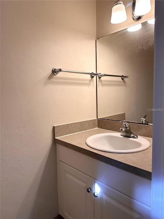 501 Southwest 75th Street, Unit G1 Gainesville, FL 32607 - Photo 11 of 20 a bathroom with a sink and a mirror