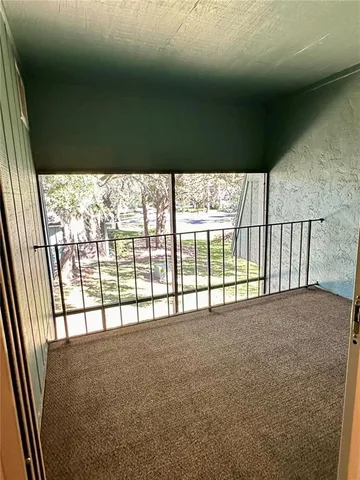 a view of an empty room with a balcony
