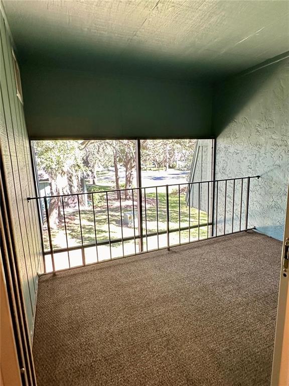 501 Southwest 75th Street, Unit G1 Gainesville, FL 32607 - Photo 14 of 20 a view of an empty room with a balcony
