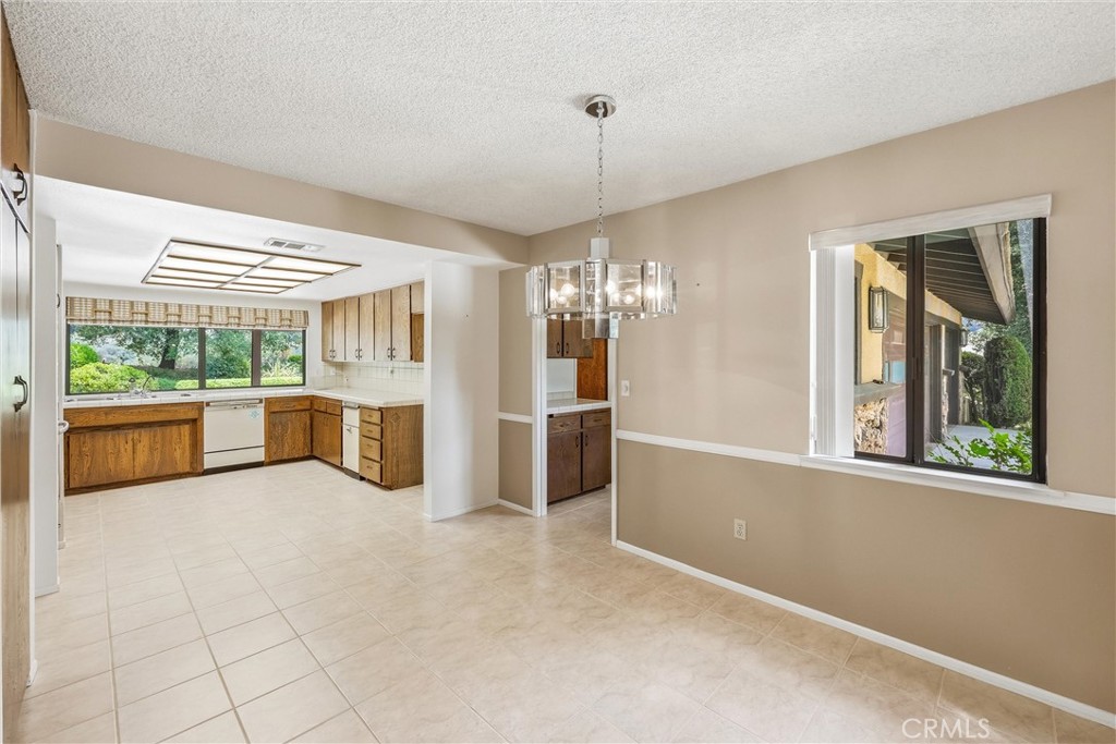 37295 Oak View Road Yucaipa, CA 92399 - Photo 11 of 59 a view of a kitchen with a sink and a window