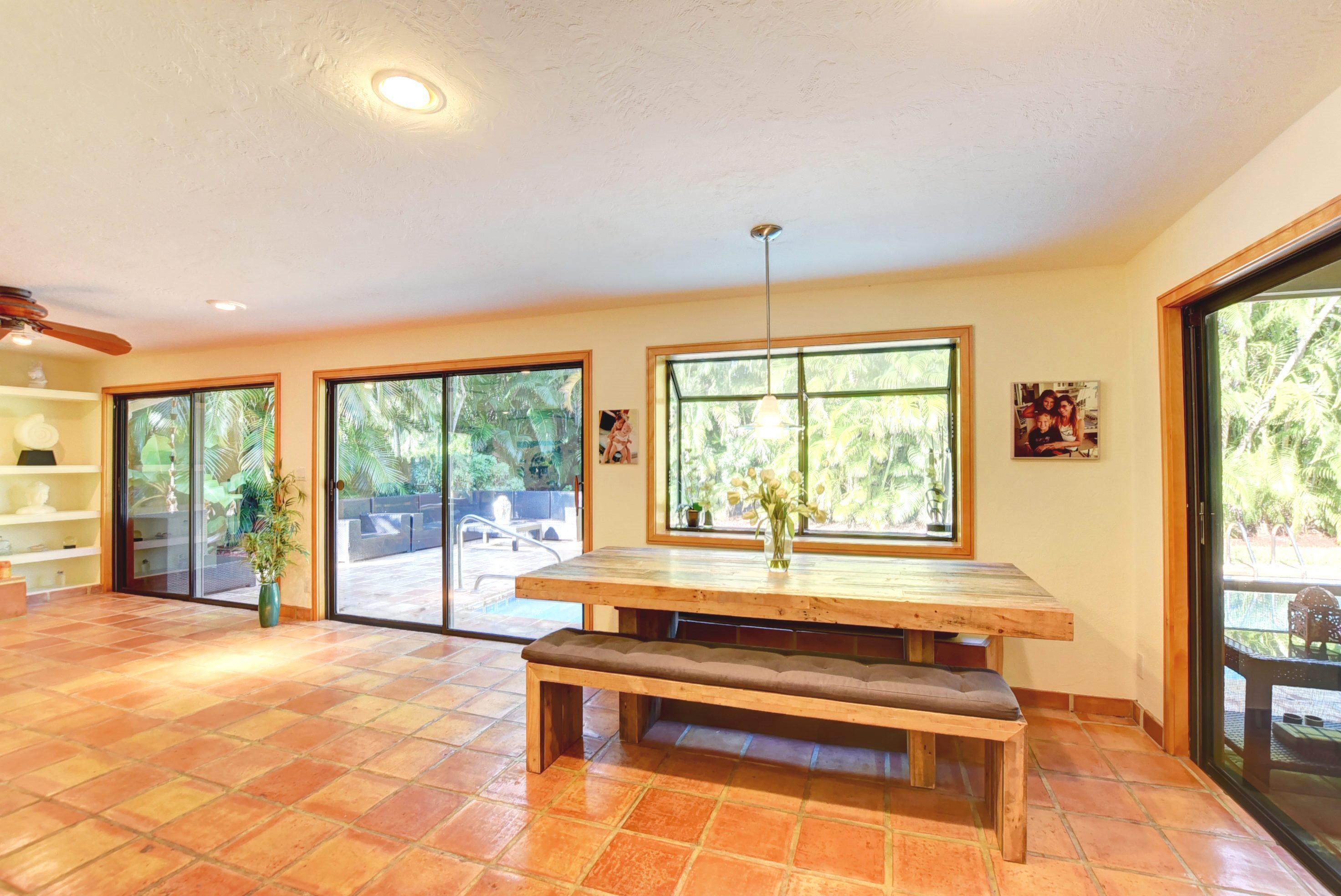 6761 Entrada Place Boca Raton, FL 33433 - Photo 19 of 69 a living room with a large window and a table