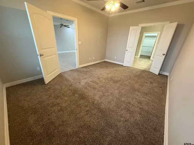 a large bathroom with a sink and a mirror