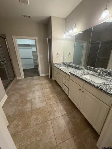 a view of an empty walk in closet