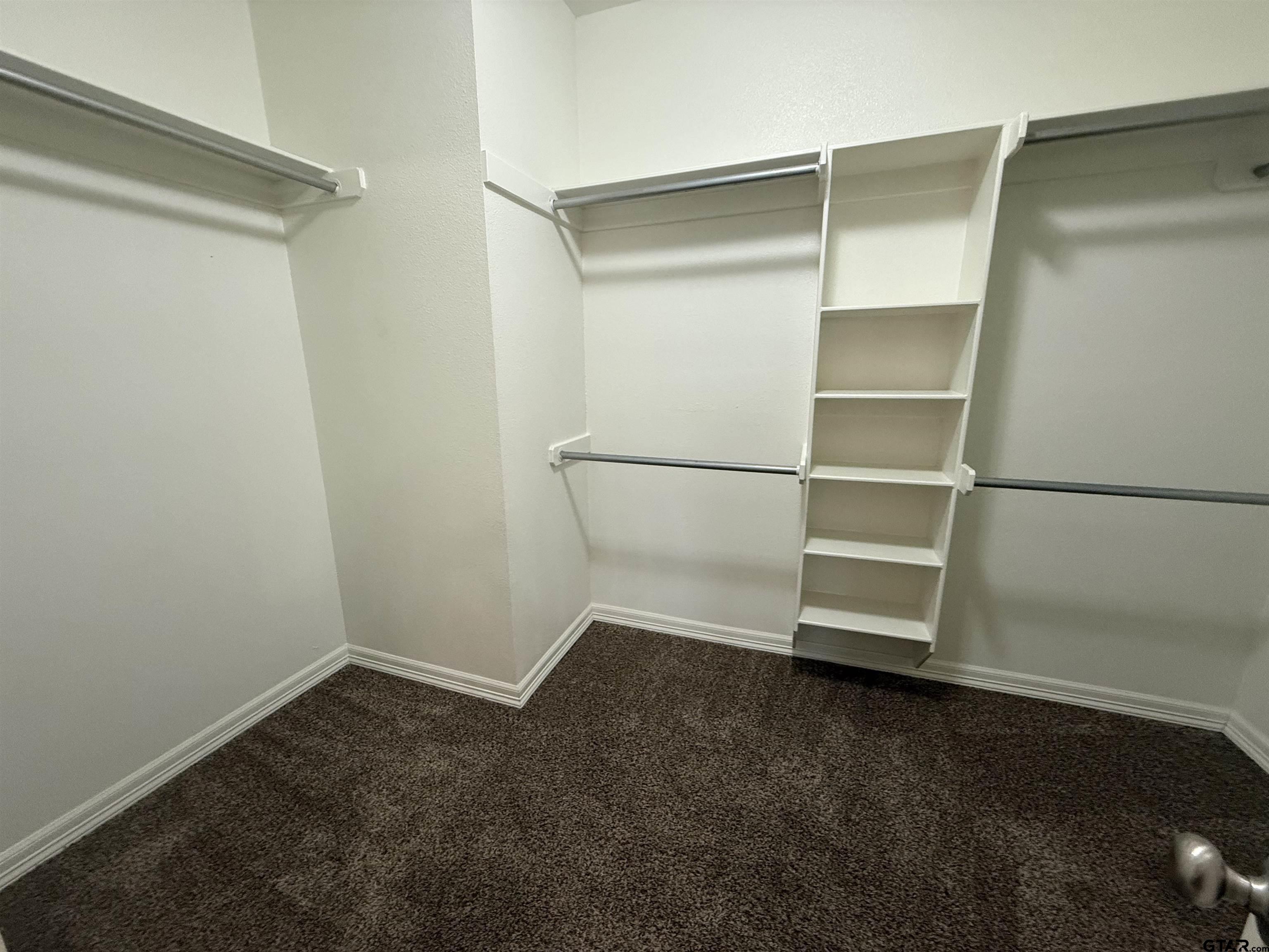 16440 County Road 178, Unit 1007 Tyler, TX 75703 - Photo 13 of 25 a view of an empty walk in closet