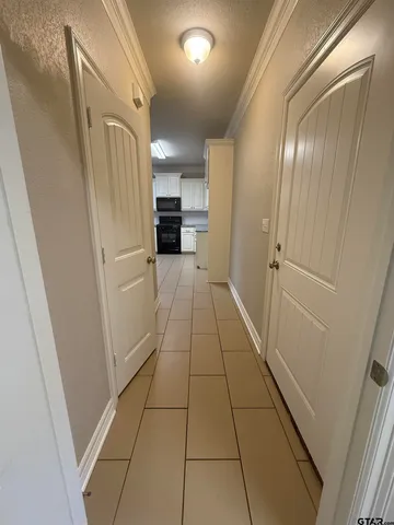 a large kitchen with a sink and cabinets