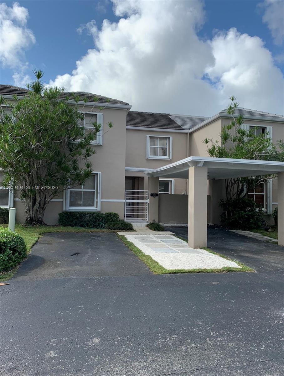 6950 Southwest 55th Terrace East Miami, FL 33155 - Photo 6 of 16 a front view of a house with a yard and garage