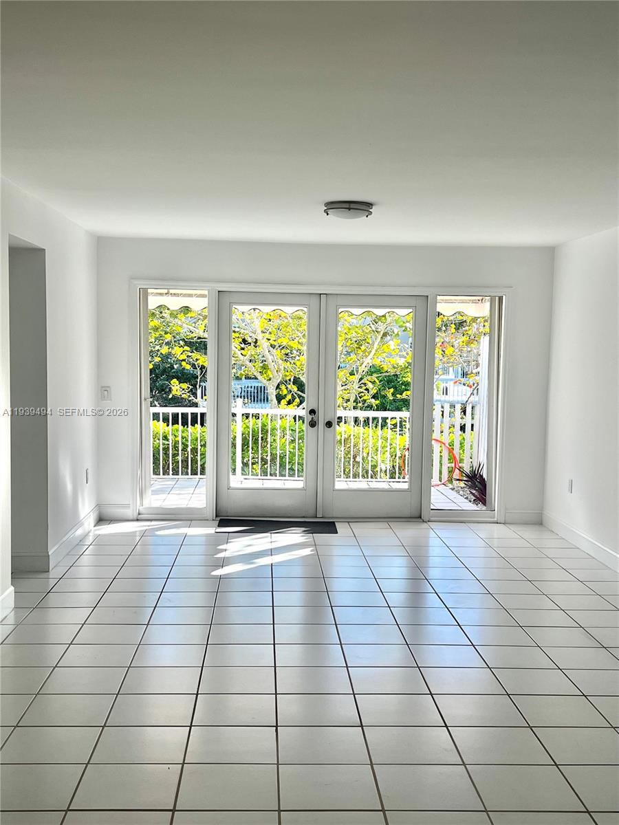 6950 Southwest 55th Terrace East Miami, FL 33155 - Photo 8 of 16 a view of an empty room with a window