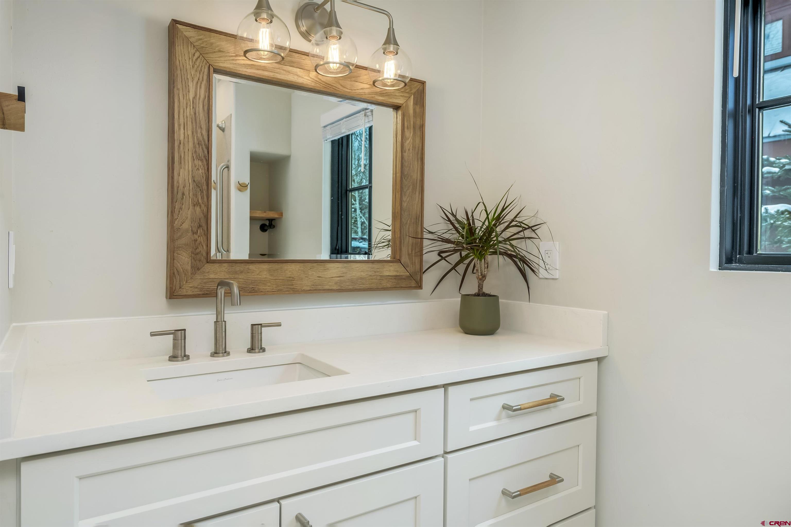 705 9th Street Crested Butte, CO 81224 - Photo 26 of 44 a bathroom with a sink and a mirror