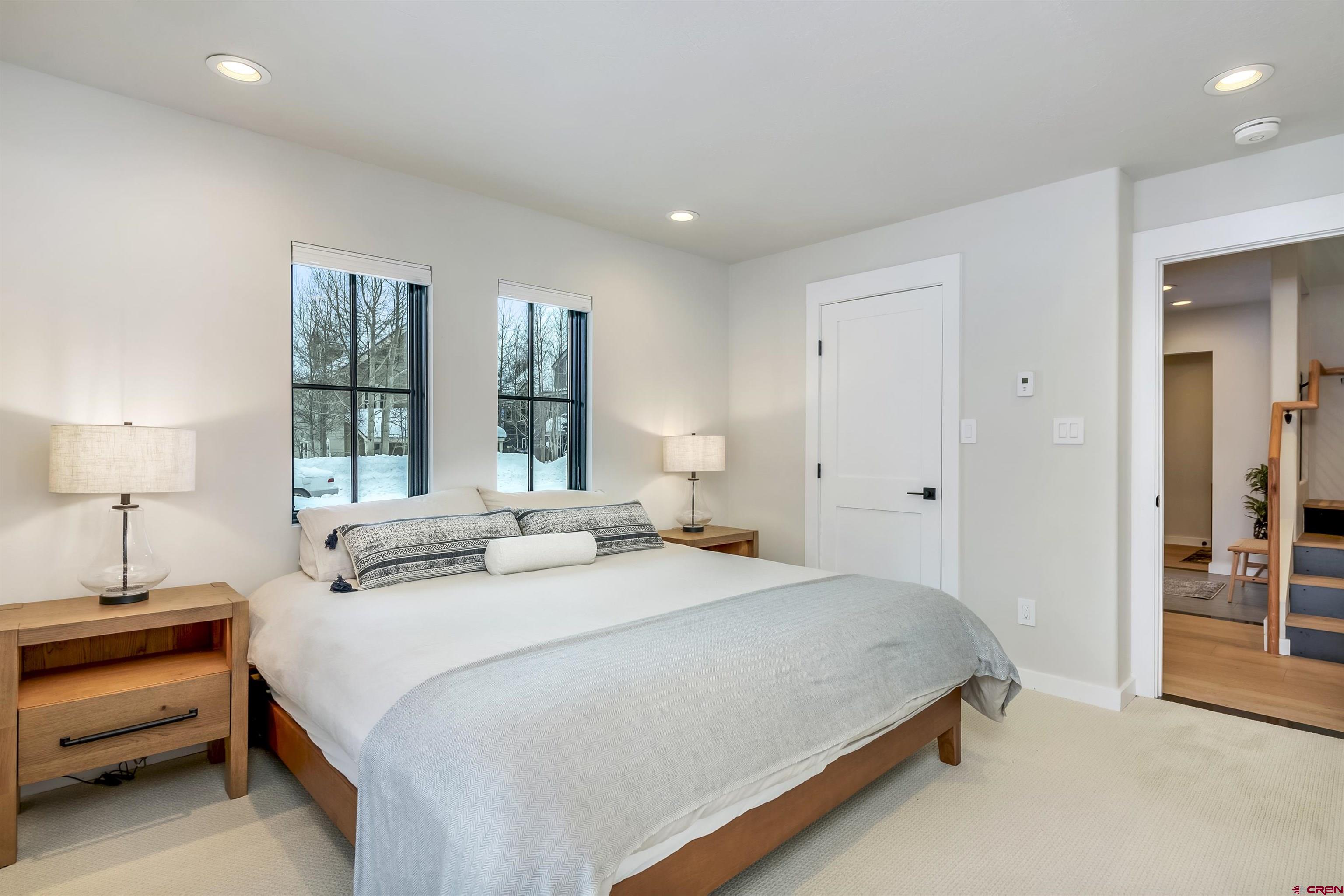 705 9th Street Crested Butte, CO 81224 - Photo 29 of 44 a bedroom with a bed and a window