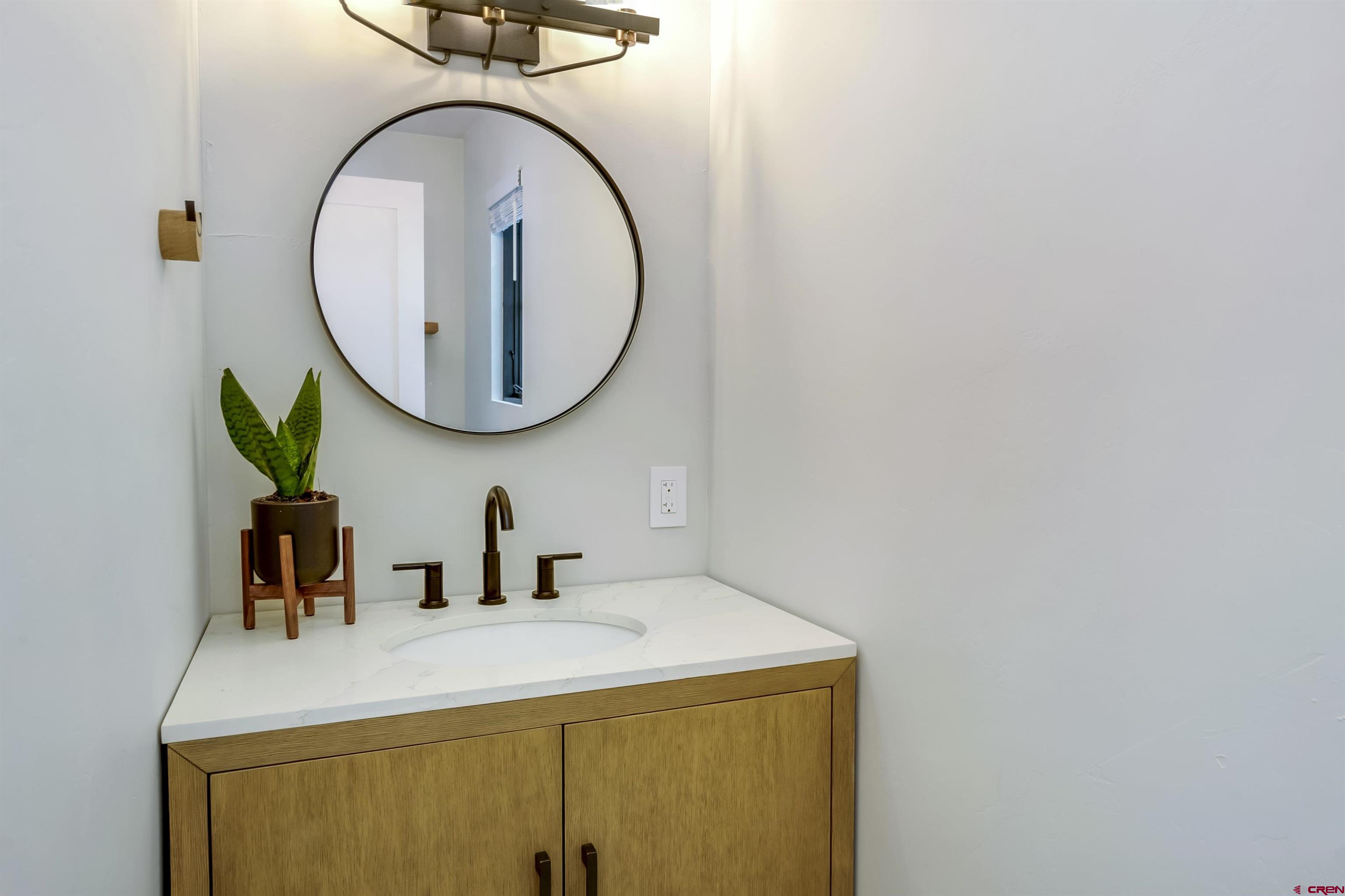 705 9th Street Crested Butte, CO 81224 - Photo 32 of 44 a bathroom with a sink and a mirror