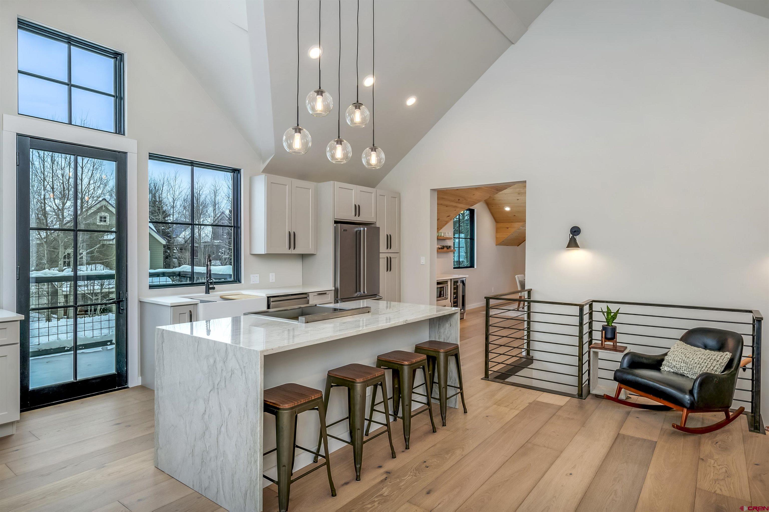 705 9th Street Crested Butte, CO 81224 - Photo 35 of 44 a view of a dining room with furniture window and wooden floor