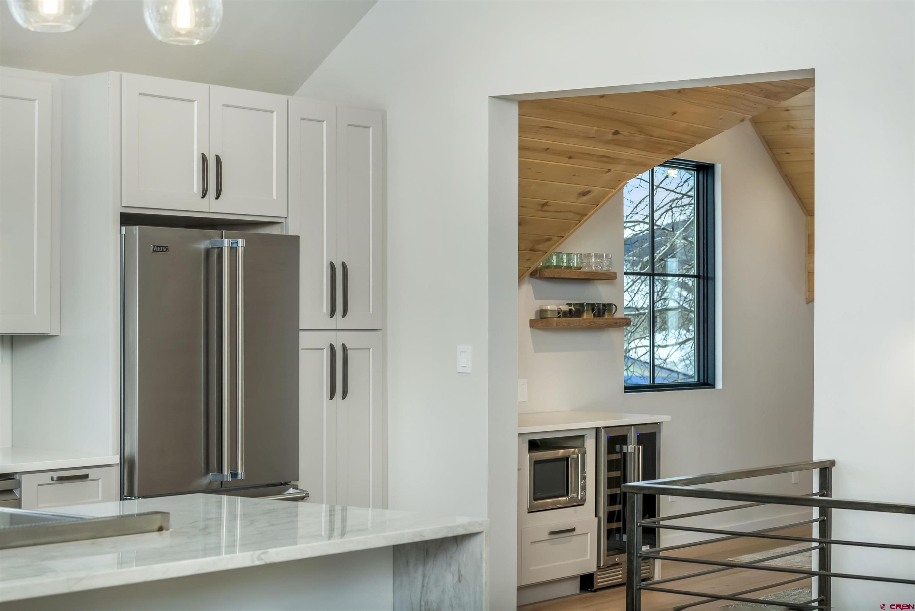 705 9th Street Crested Butte, CO 81224 - Photo 36 of 44 a view of a refrigerator in kitchen and wooden floor