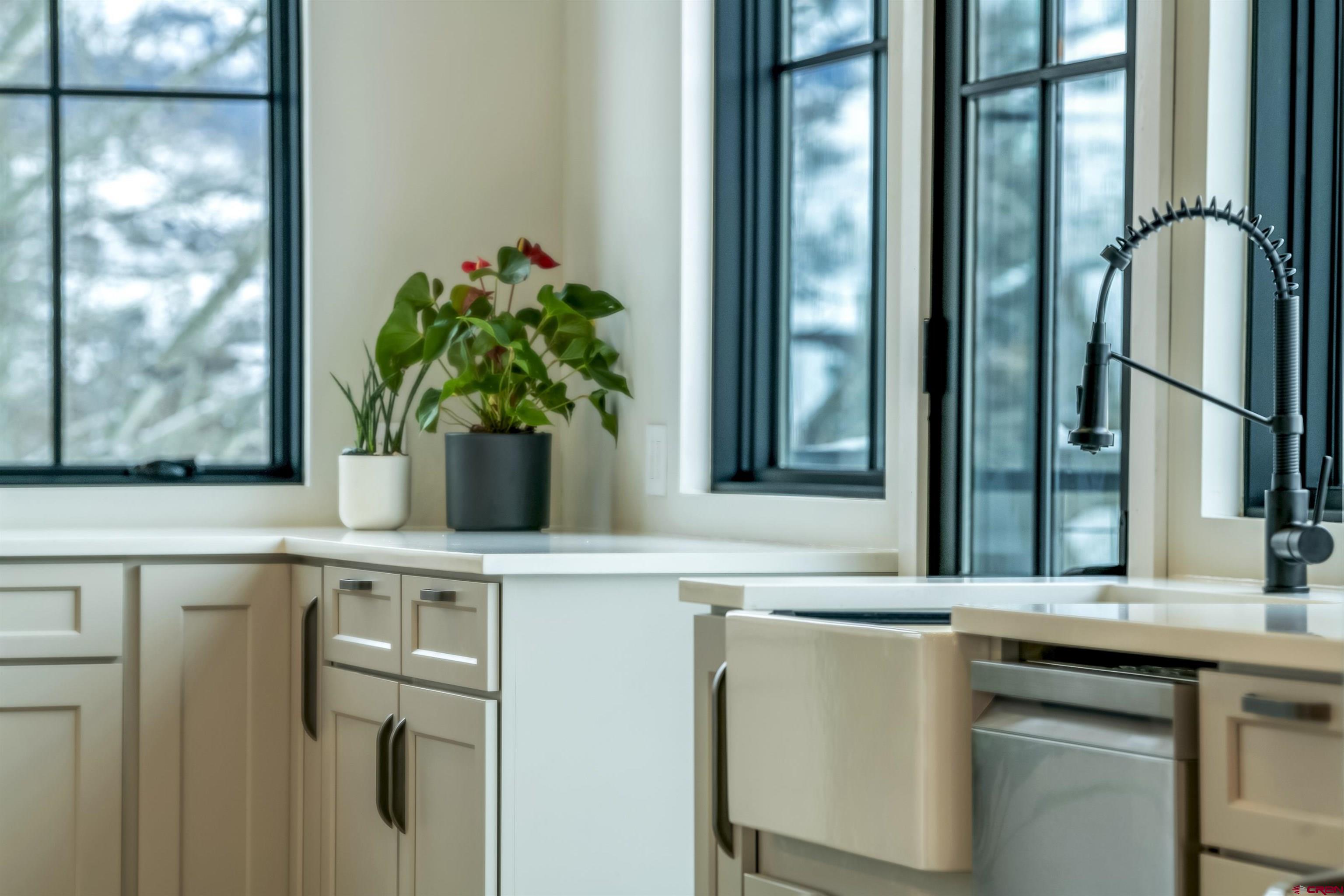 705 9th Street Crested Butte, CO 81224 - Photo 8 of 44 a vase of flowers sitting on a table with chair