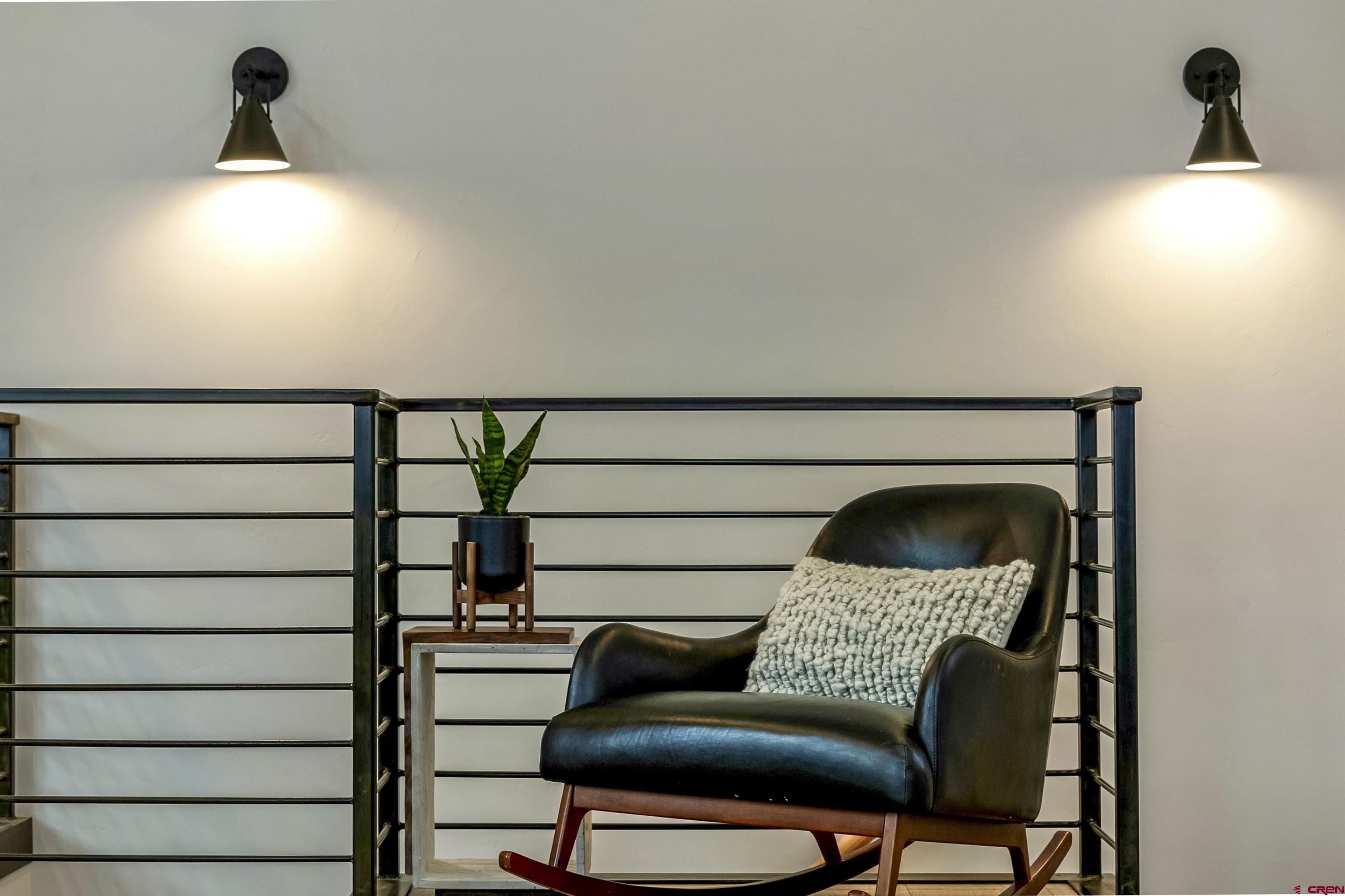 705 9th Street Crested Butte, CO 81224 - Photo 9 of 44 a bedroom with a bed and a chair