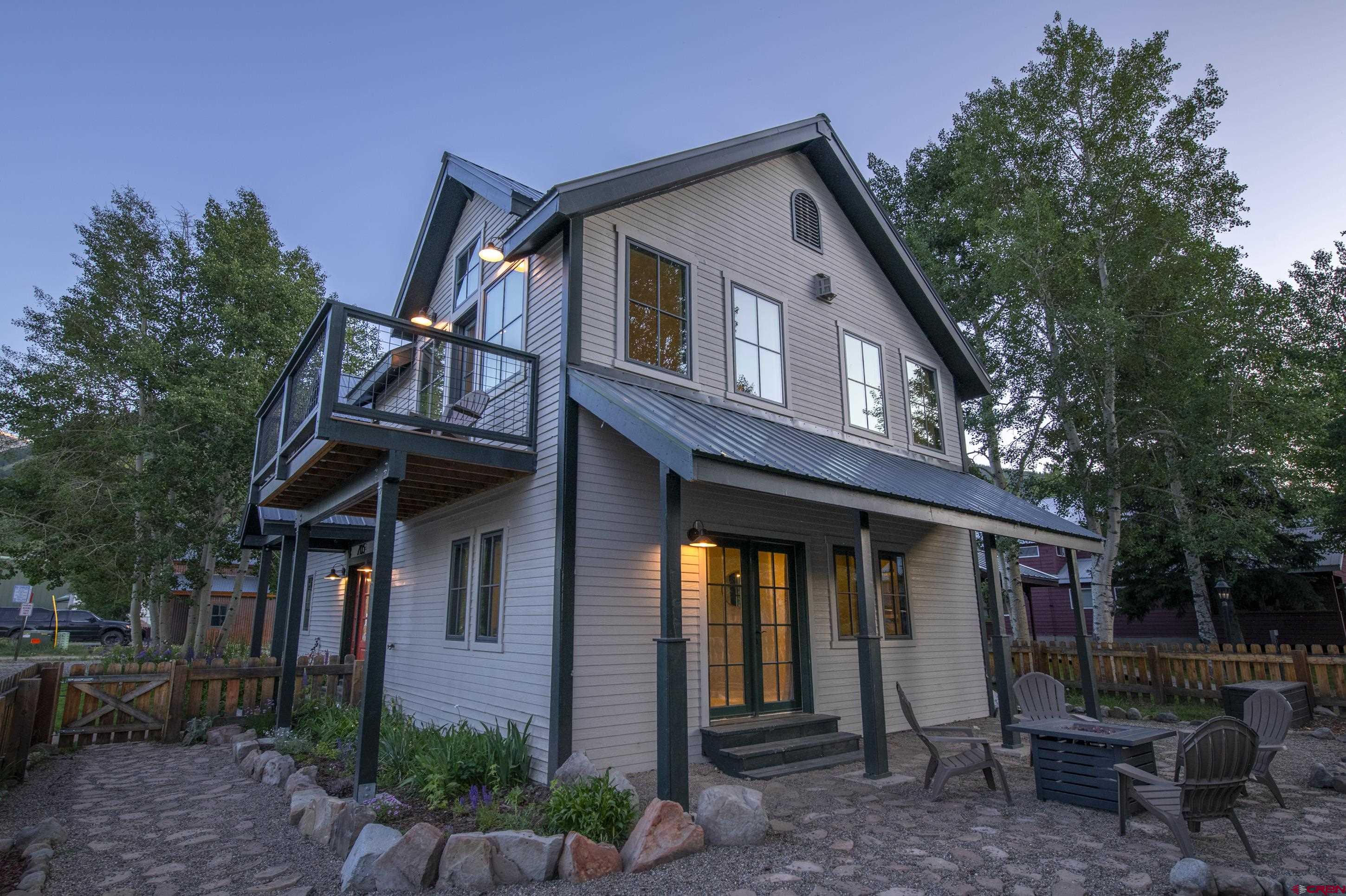 705 9th Street Crested Butte, CO 81224 - Photo 10 of 44 a front view of a house with garden and plants
