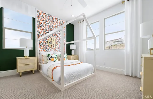 a bedroom with bed and window