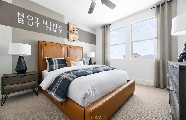 a bedroom with a bed and a night stand