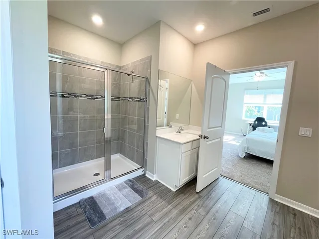 a bathroom with a double vanity sink and mirror