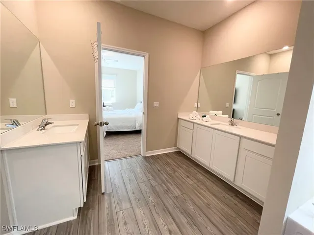 a bathroom with a sink a mirror and a toilet